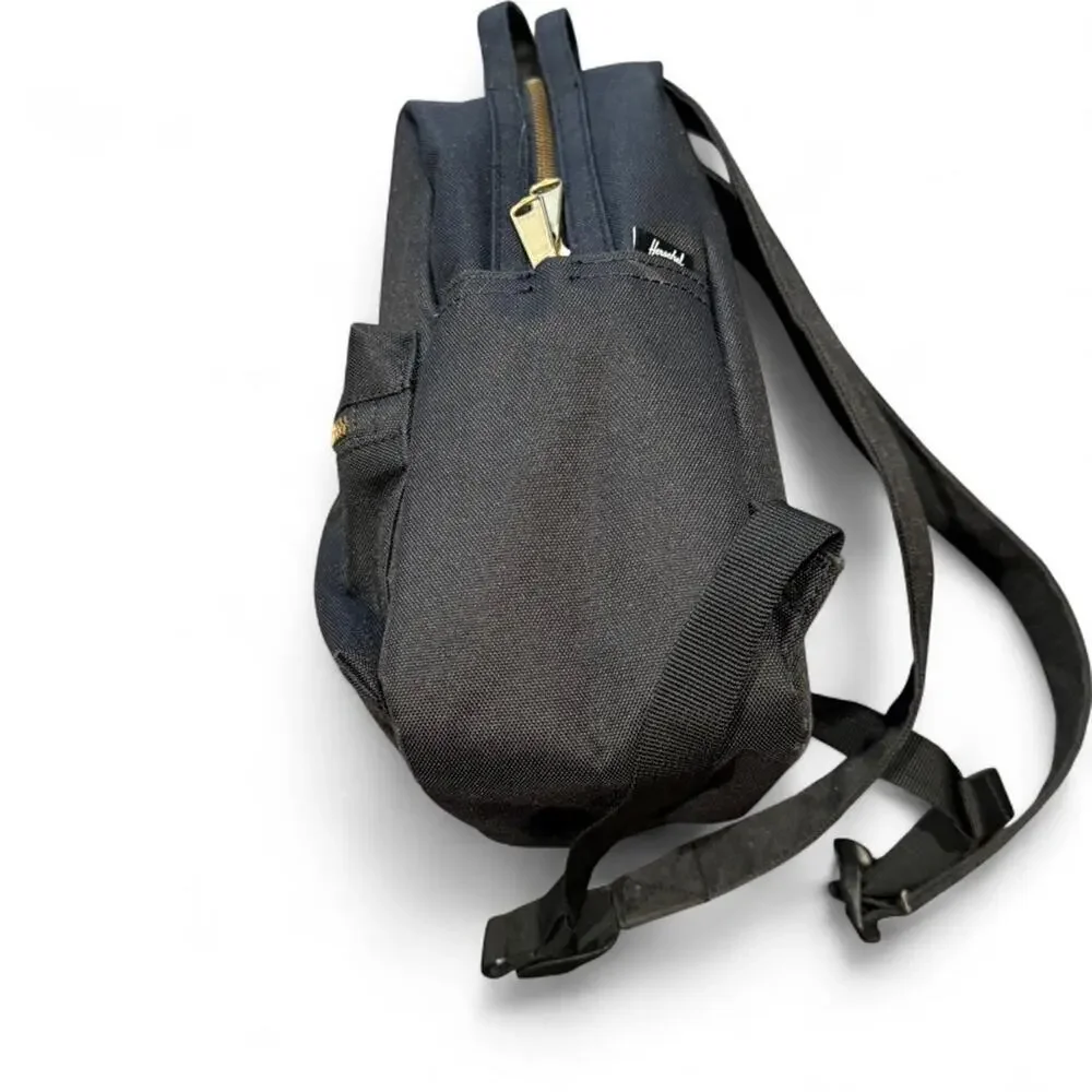 Herschel Nova mini black canvas backpack with gold zipper